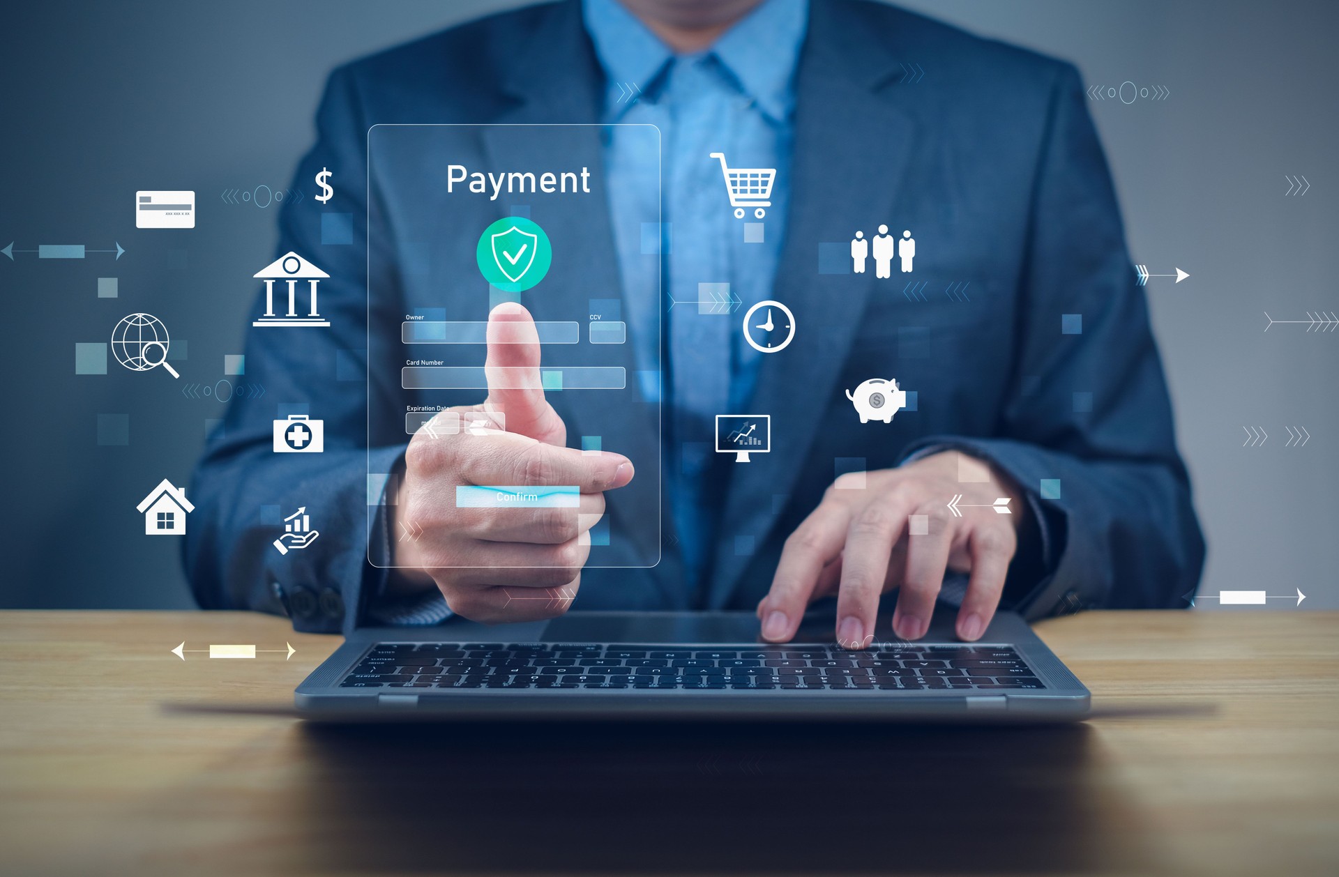 Businessman interacting with digital payment icons on a laptop, symbolizing online transactions and finance technology.